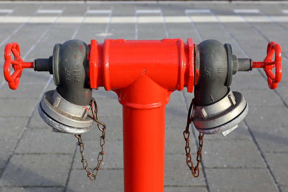 red and silver steel pipe