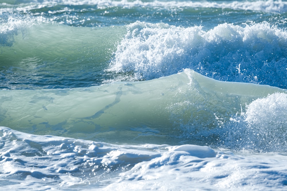 white ice on body of water during daytime