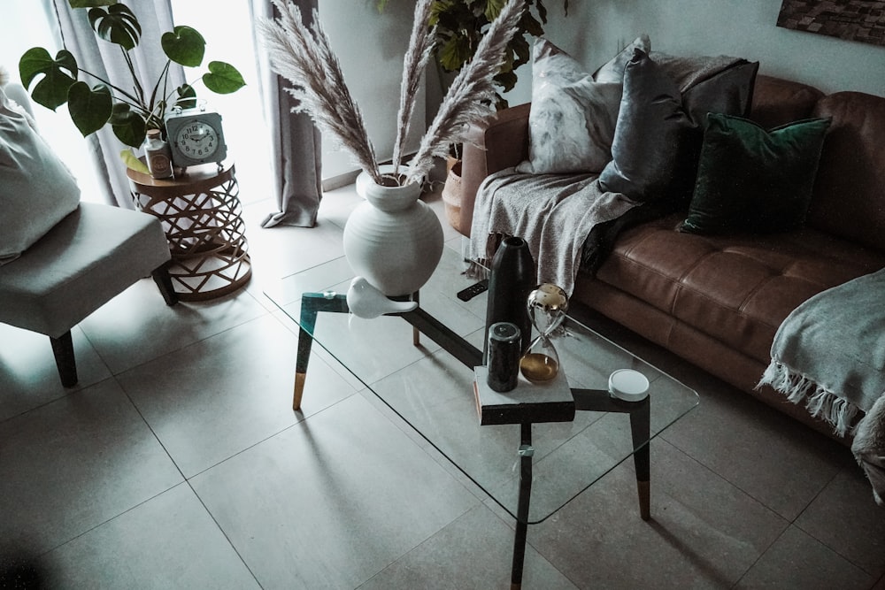 white ceramic vase on glass table