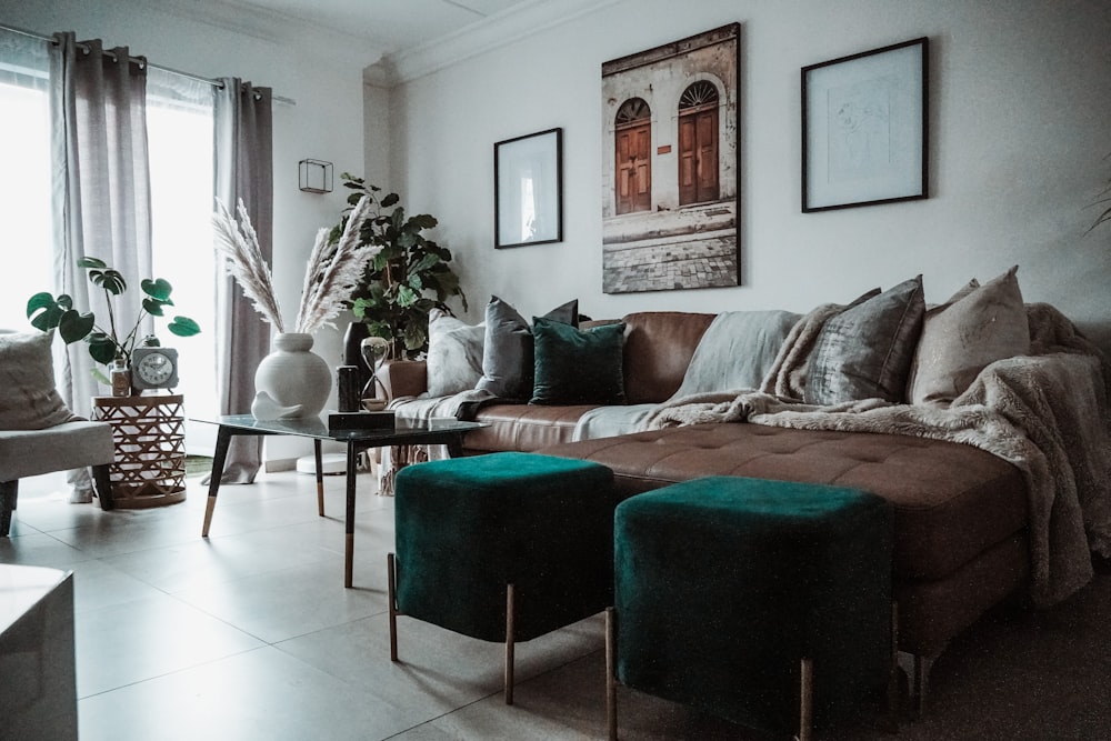 brown and black couch beside black and white round table