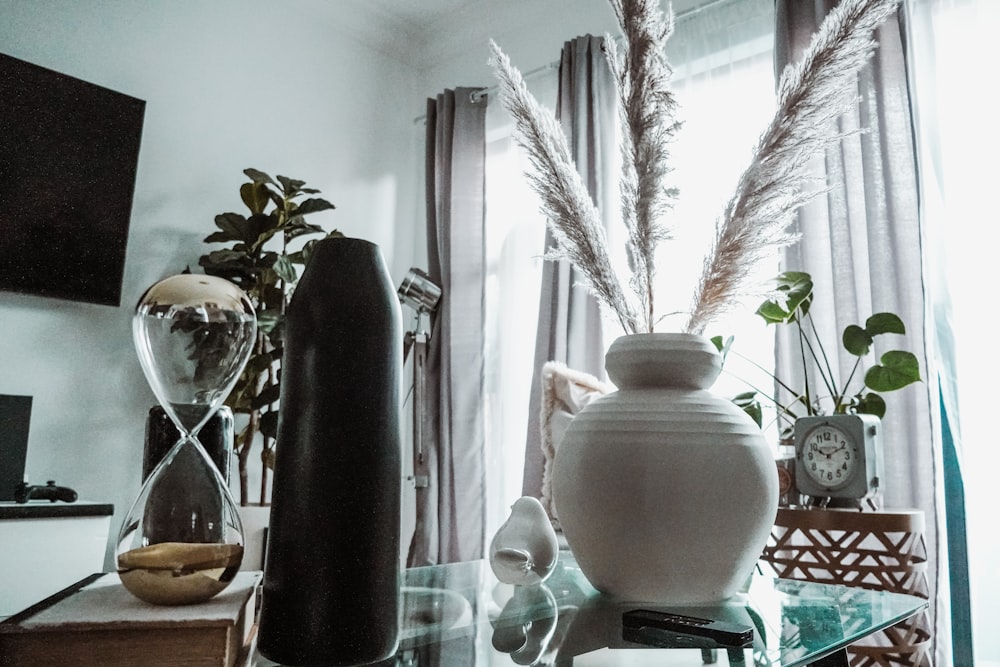 white ceramic vase on glass table