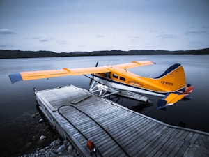 Floatplane at dock on Lake Rosseau, luxury waterfront travel. 