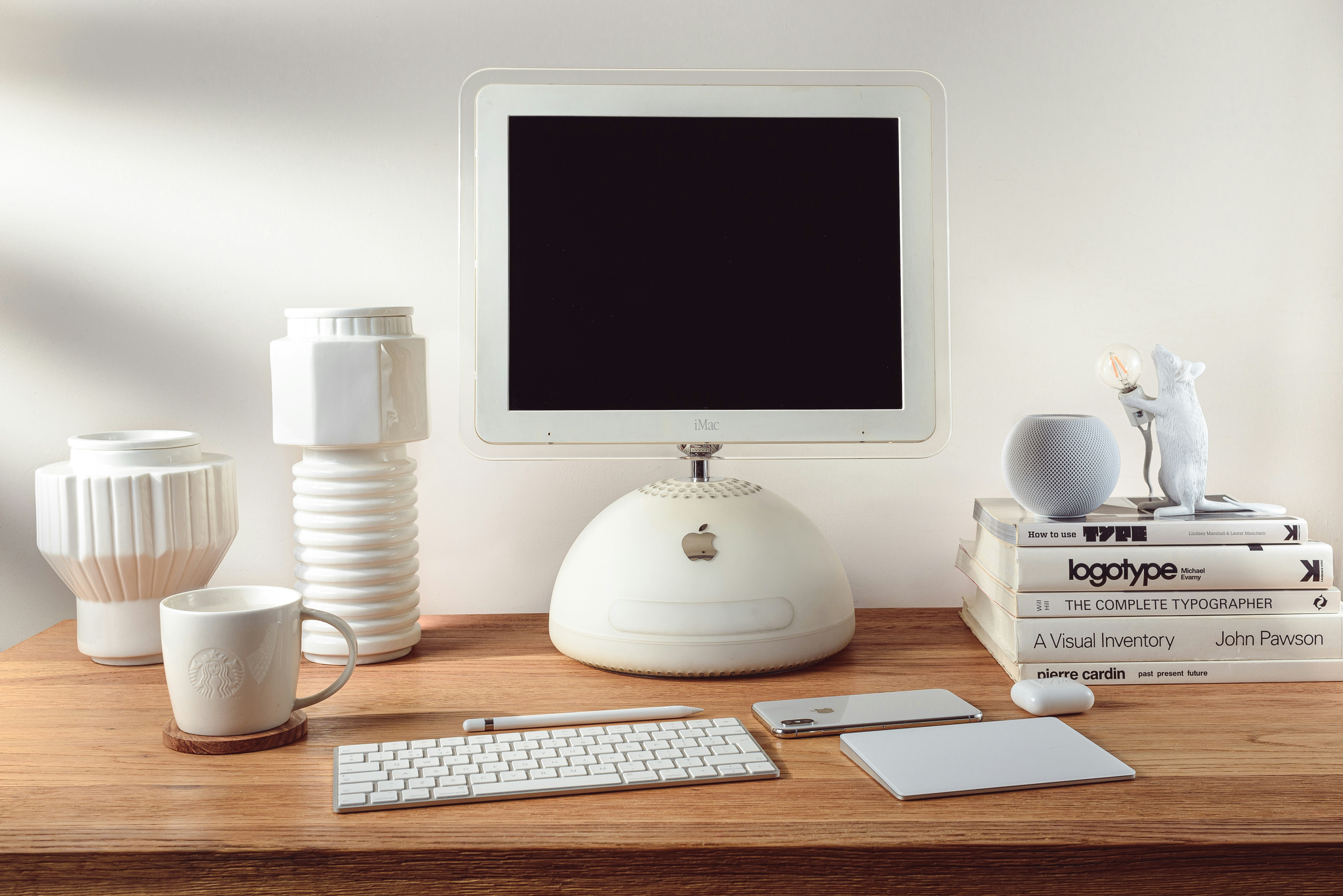 vintage unibody Apple Mac mini computer stacked on desk