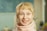 smiling blonde girl wearing white scarf