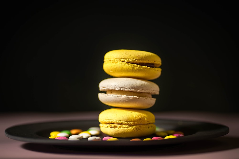 3 brown cookies on black plate