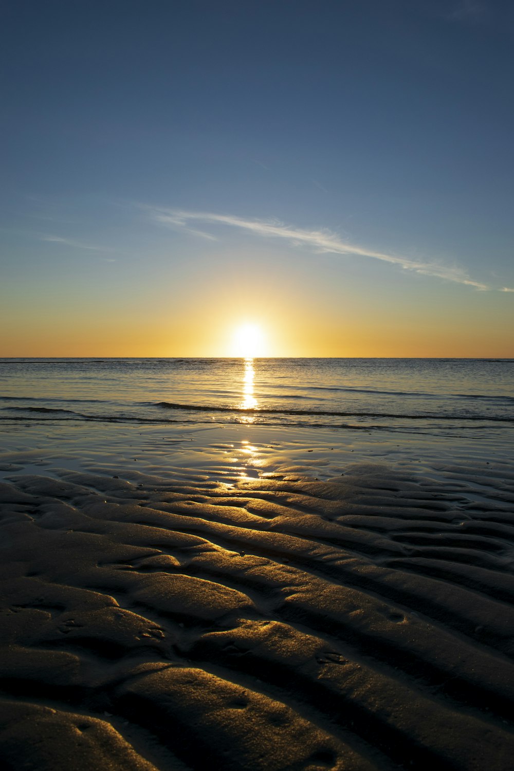 calm sea under blue sky during daytime