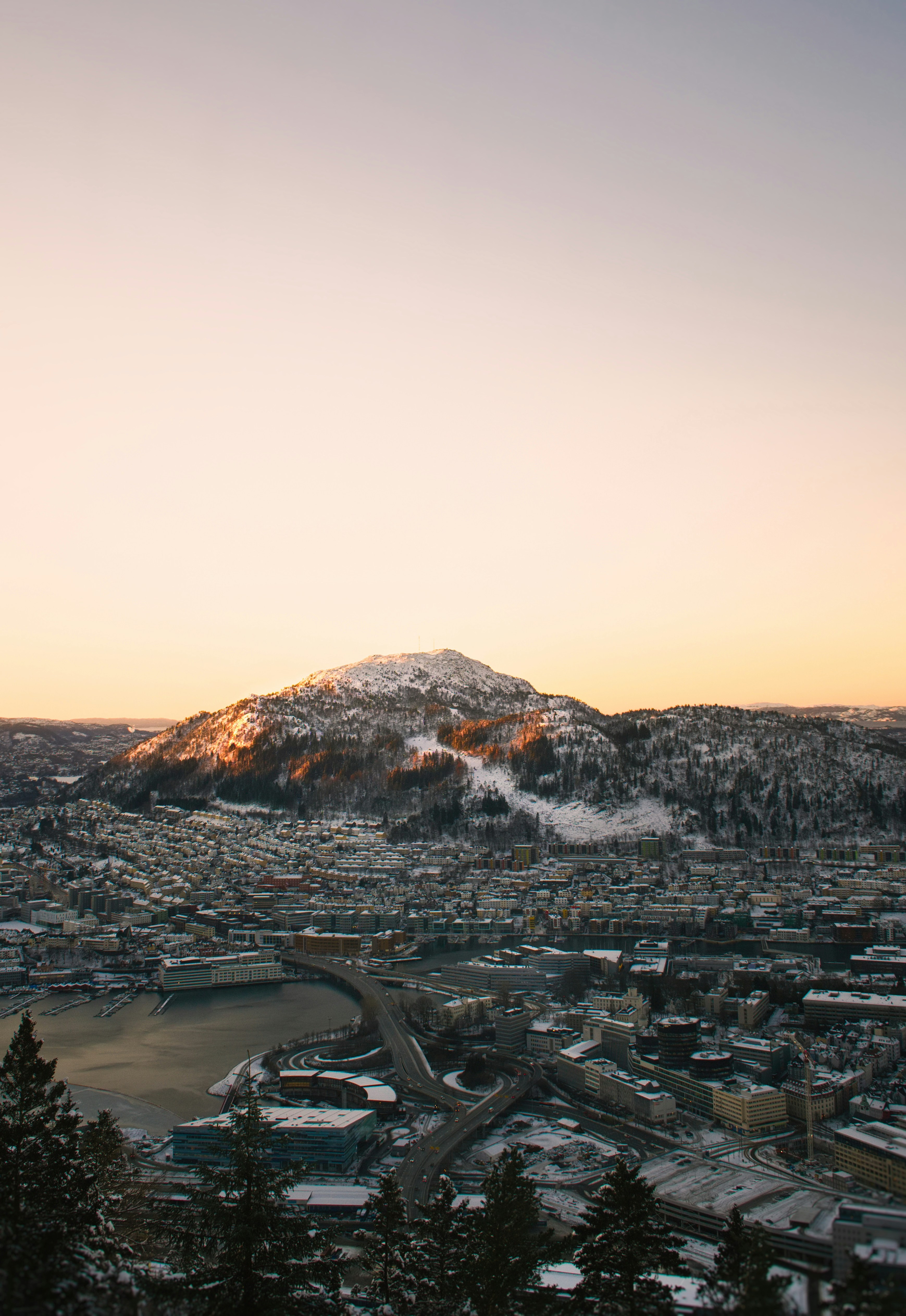 Brown and white mountain near body of water during daytime photo – Free ...