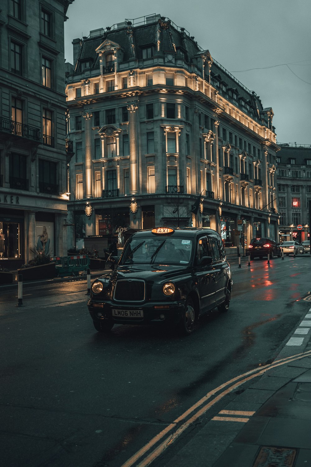 black car on road near building during daytime