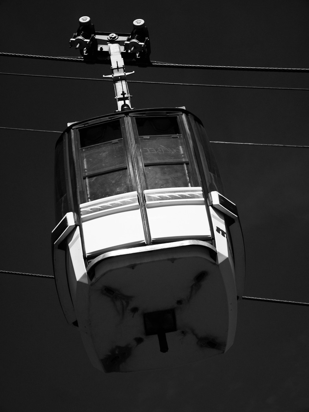 grayscale photo of a cable car
