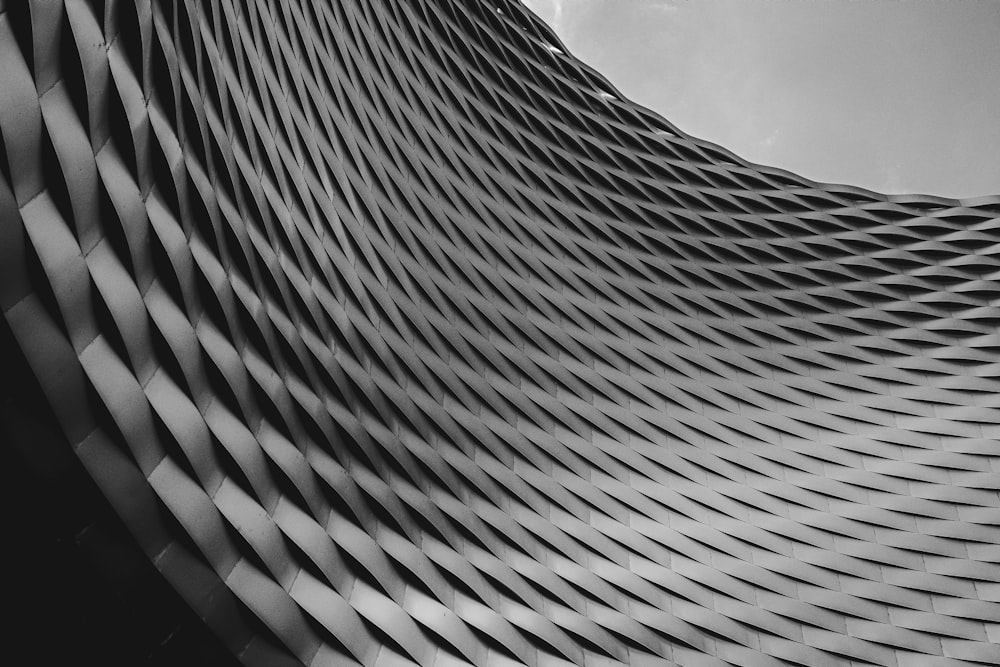 worms eye view of gray concrete building under cloudy sky during daytime