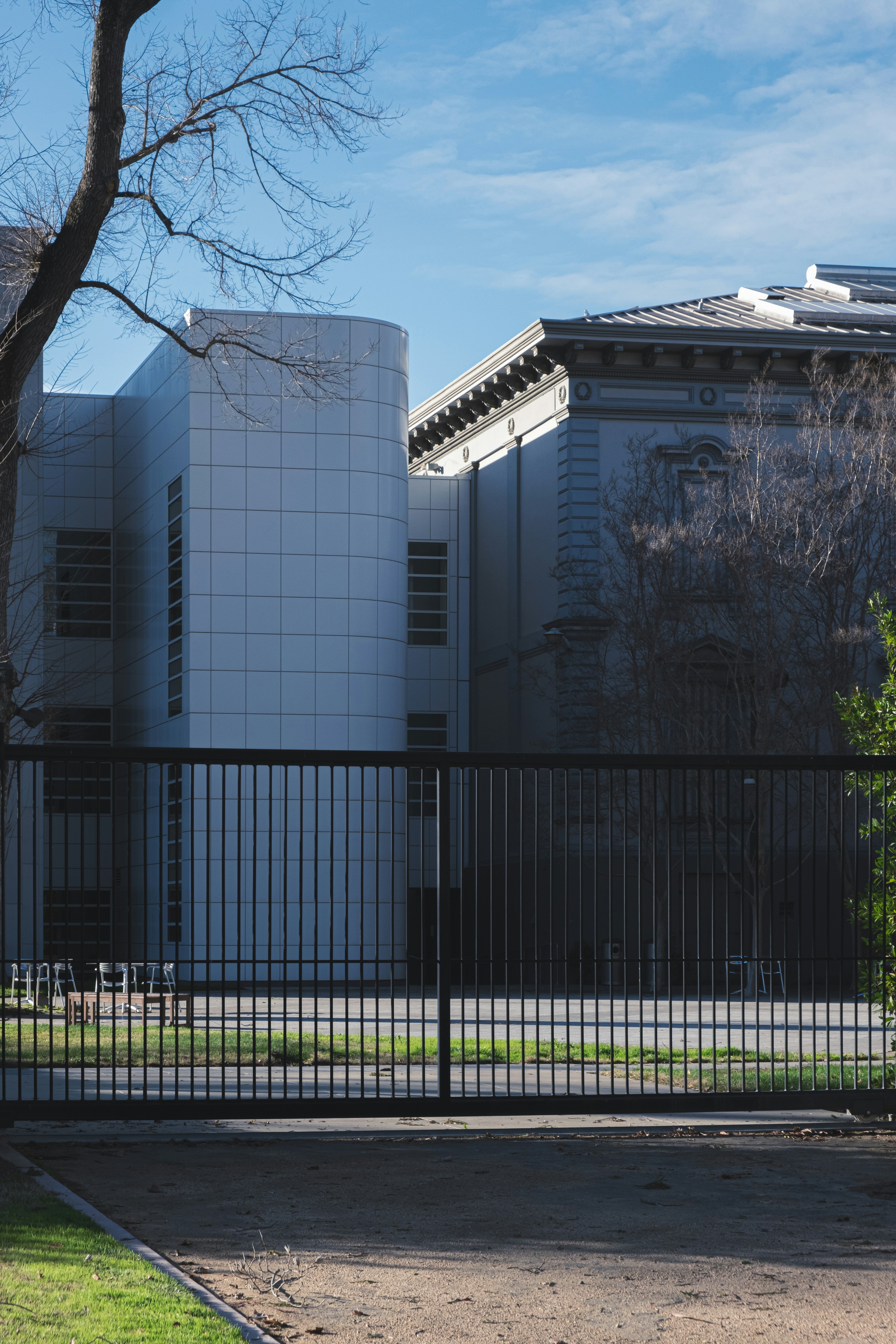 Contemporary security gate with mesh panel design