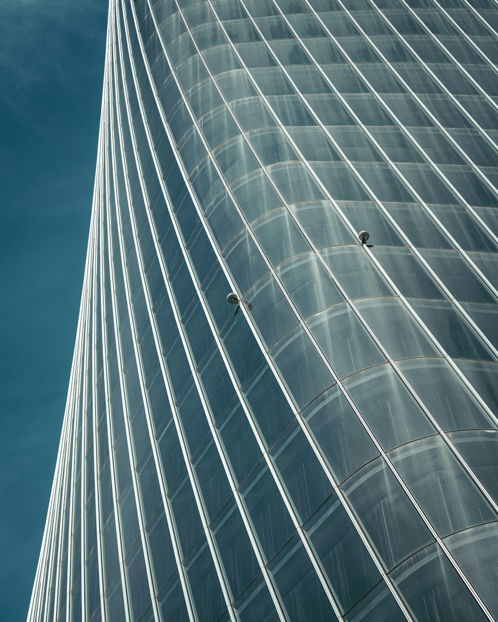 white and black building under blue sky during daytime