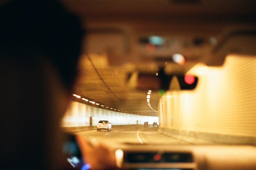 white car on road during night time