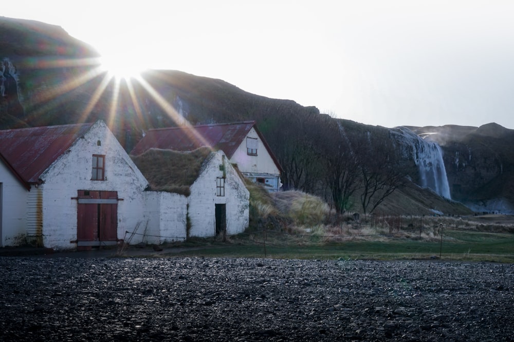 white and brown house near mountain during daytime