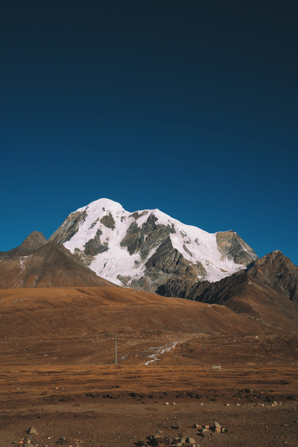 snow covered mountain under blue sky during daytime