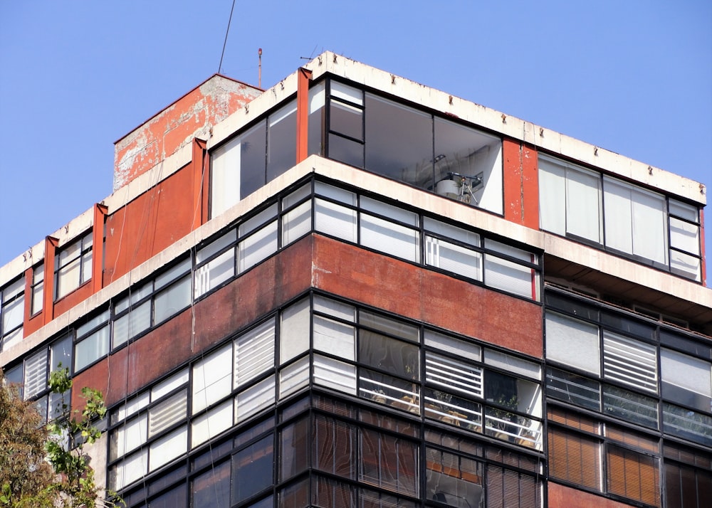 brown and white concrete building under blue sky during daytime