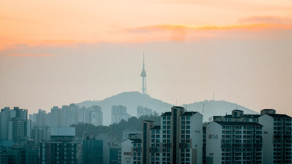 city skyline under orange sky