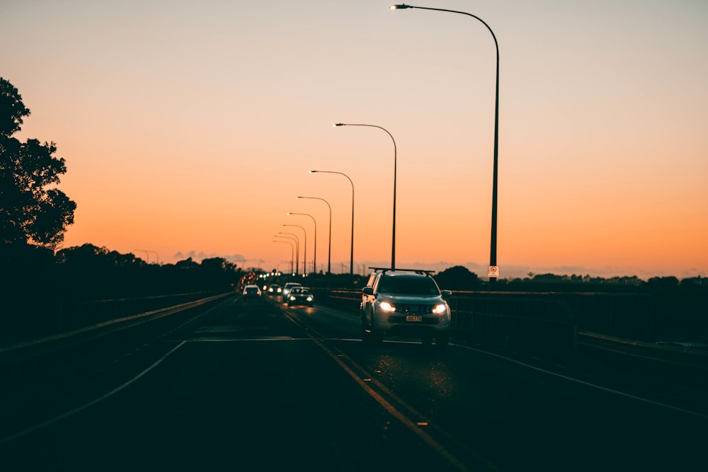 cars on road during sunset