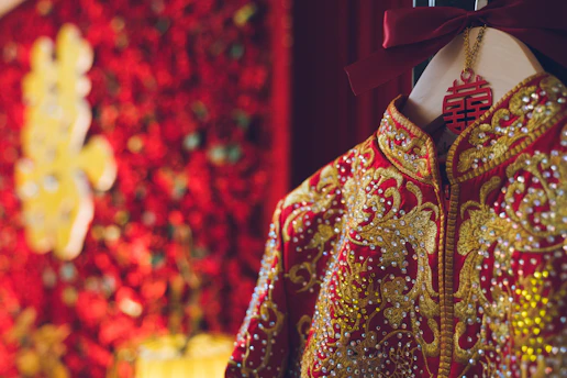 Elegant Chinese-style brocade purses displayed on a silk cloth background.
