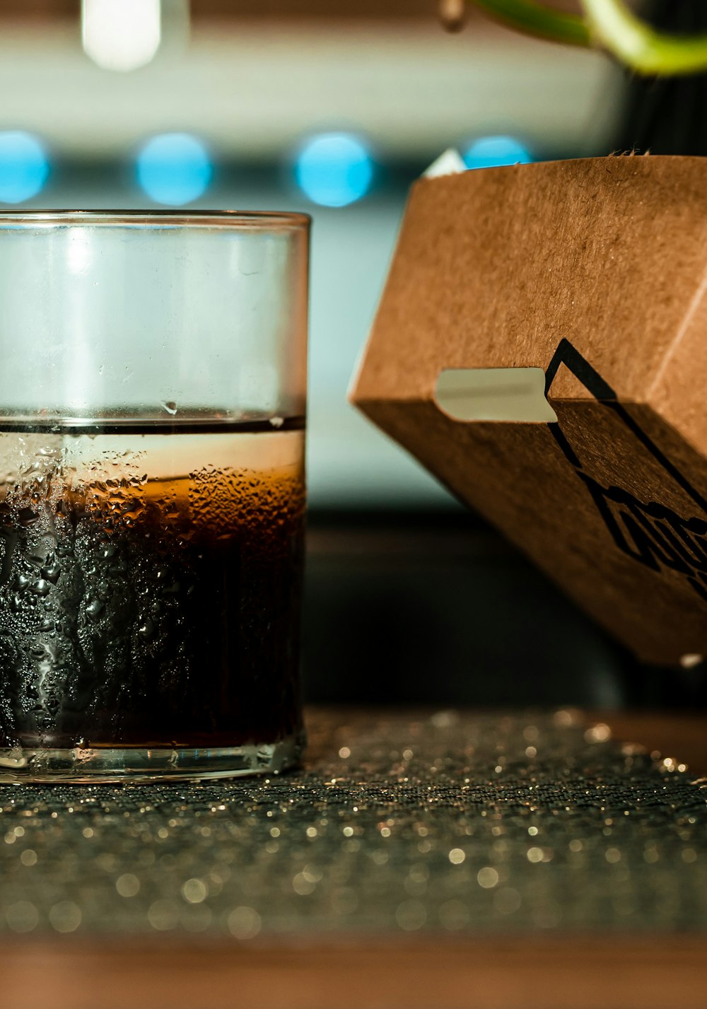 clear drinking glass with black liquid inside