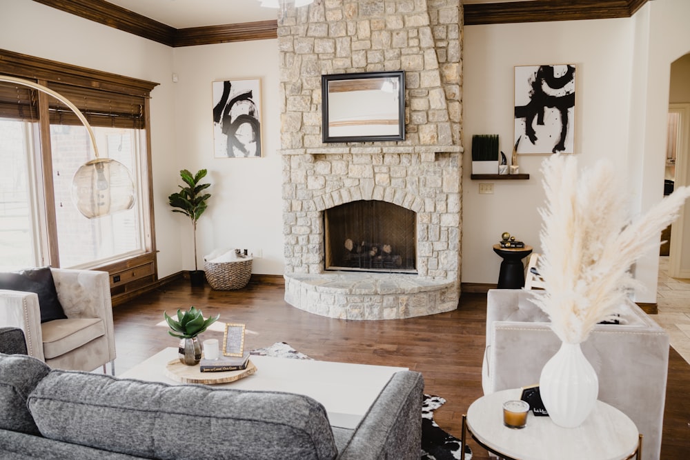 a living room filled with furniture and a fire place