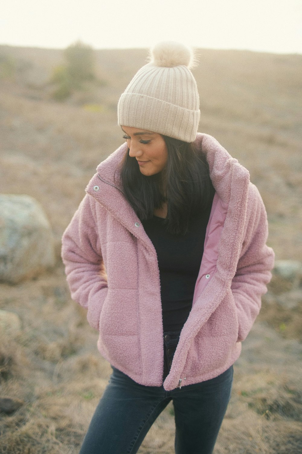 woman in pink knit cap and pink jacket