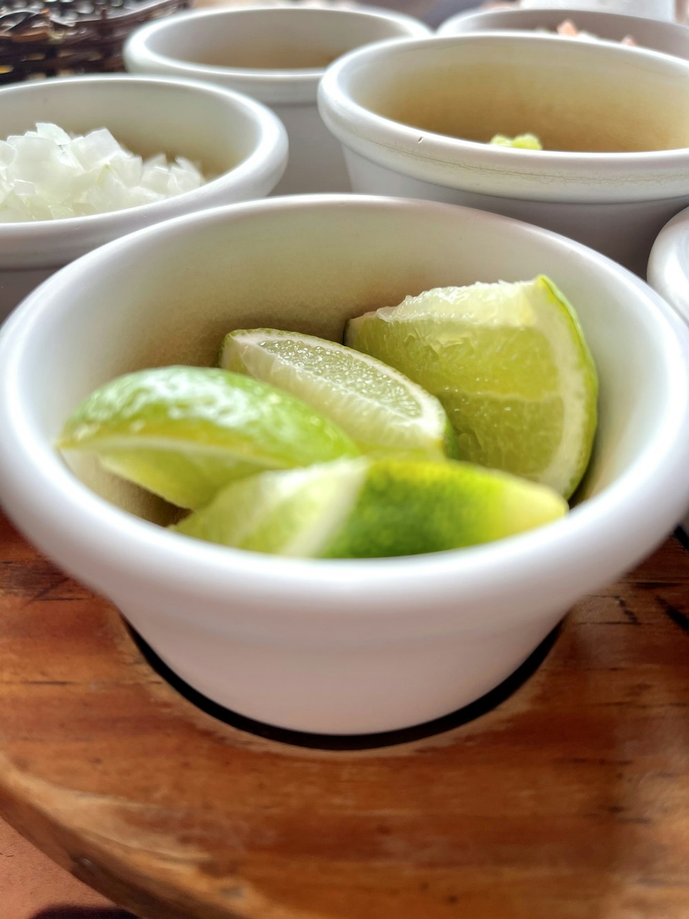 sliced lime in white ceramic bowl