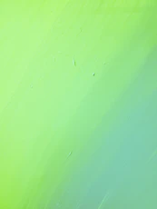 green painted wall with hole