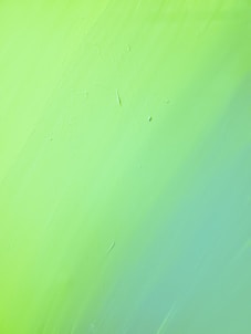 green painted wall with hole