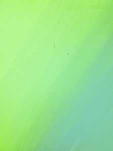 green painted wall with hole