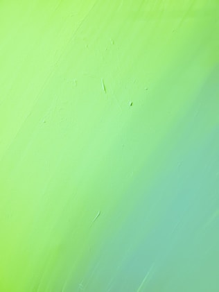 green painted wall with hole