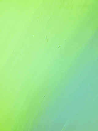 green painted wall with hole