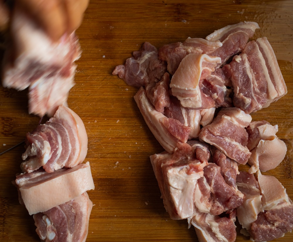 sliced meat on brown wooden table