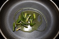 green vegetable on stainless steel round plate