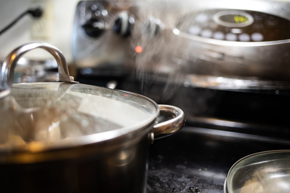 stainless steel cooking pot on black table