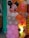 A decorative balloon arrangement resembling a cartoon character with a large head featuring black ears and a smiling face. The balloons are predominantly pink with white polka dots, accompanied by others in pastel shades. The background includes more balloons in orange, pink, and white colors.
