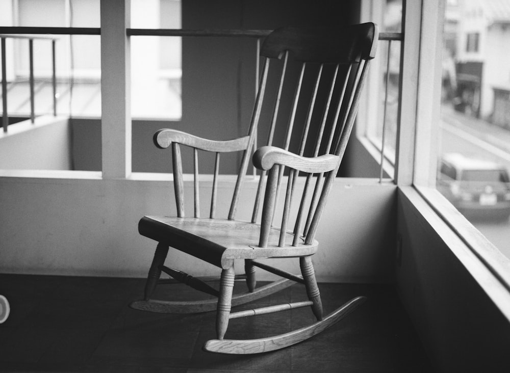 grayscale photo of rocking chair