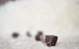 Close-up of a beautifully carved wooden animal figurine with intricate details.