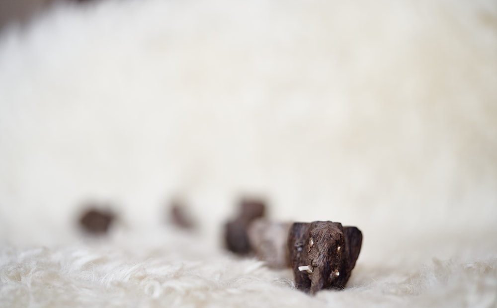 brown rock on white sand