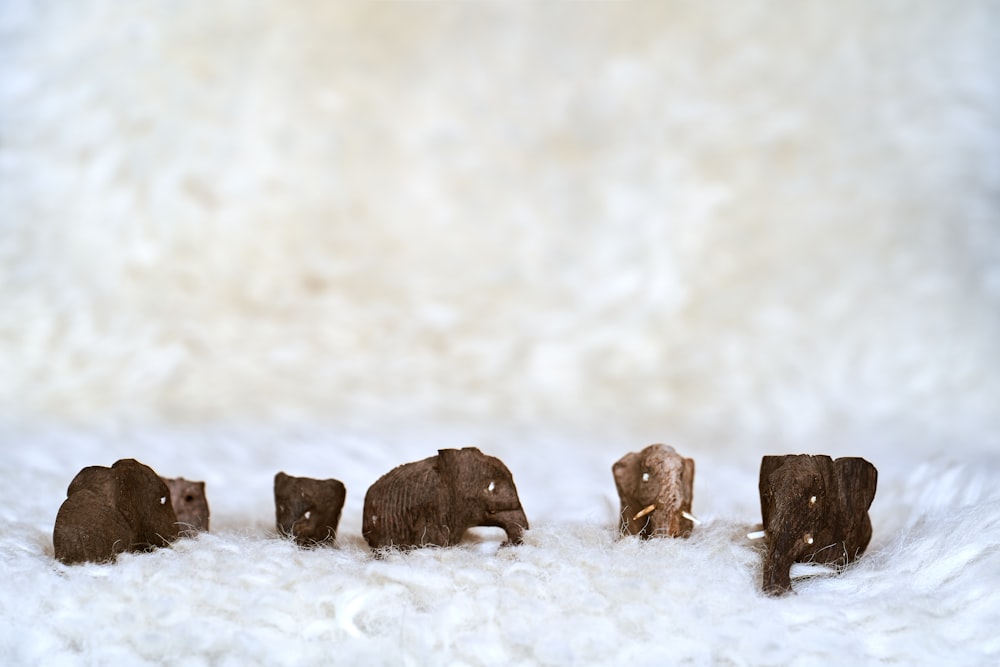 brown rock formation on snow covered ground