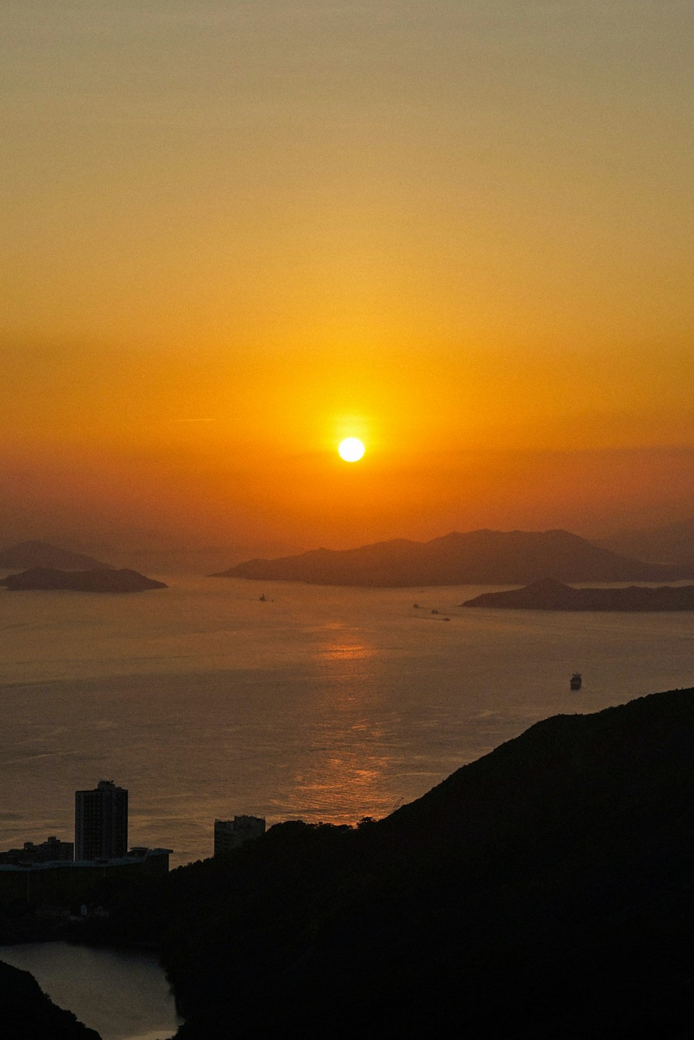 silhouette of city buildings during sunset