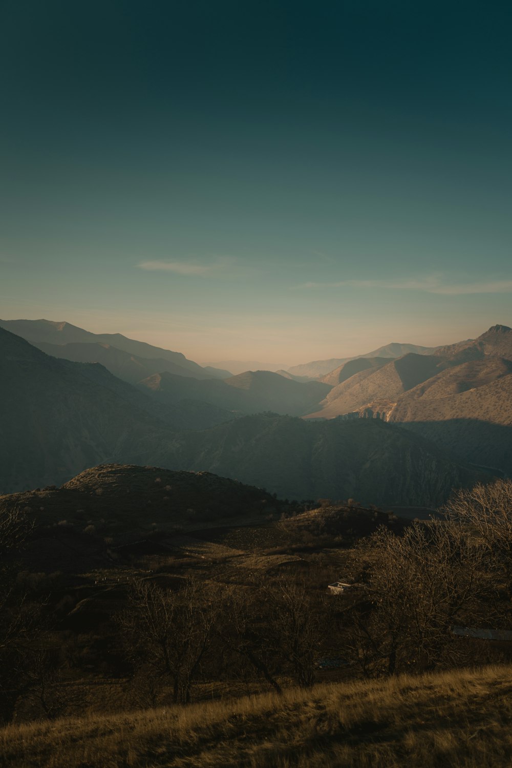 green and brown mountains under blue sky during daytime