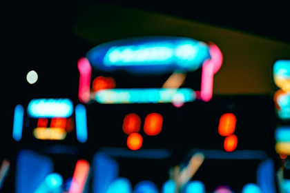 A blurred, faded image of a casino front door serving as a subtle background.