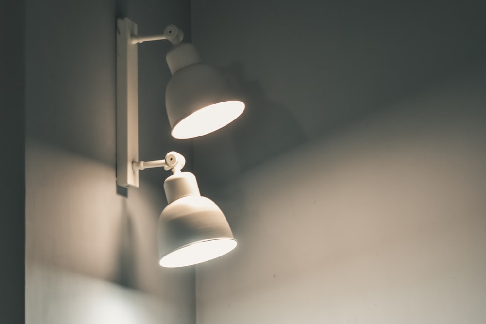 white pendant lamp turned on in room