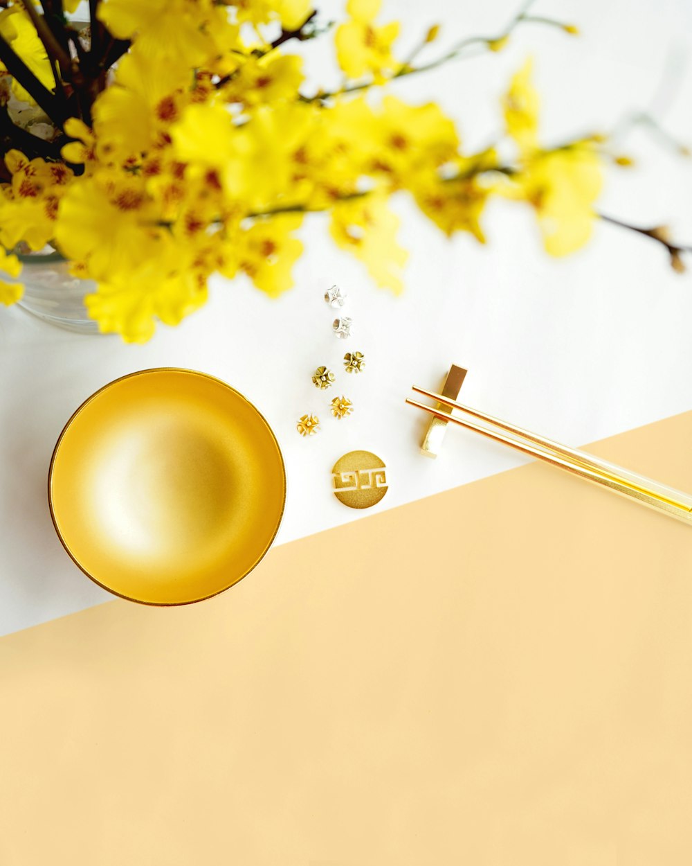 yellow round balloon with silver spoon