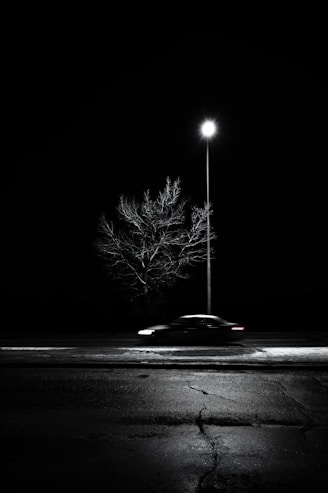 black car on road during night time
