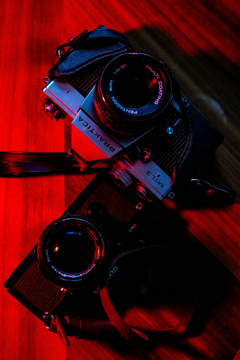 black and silver nikon dslr camera on brown wooden table