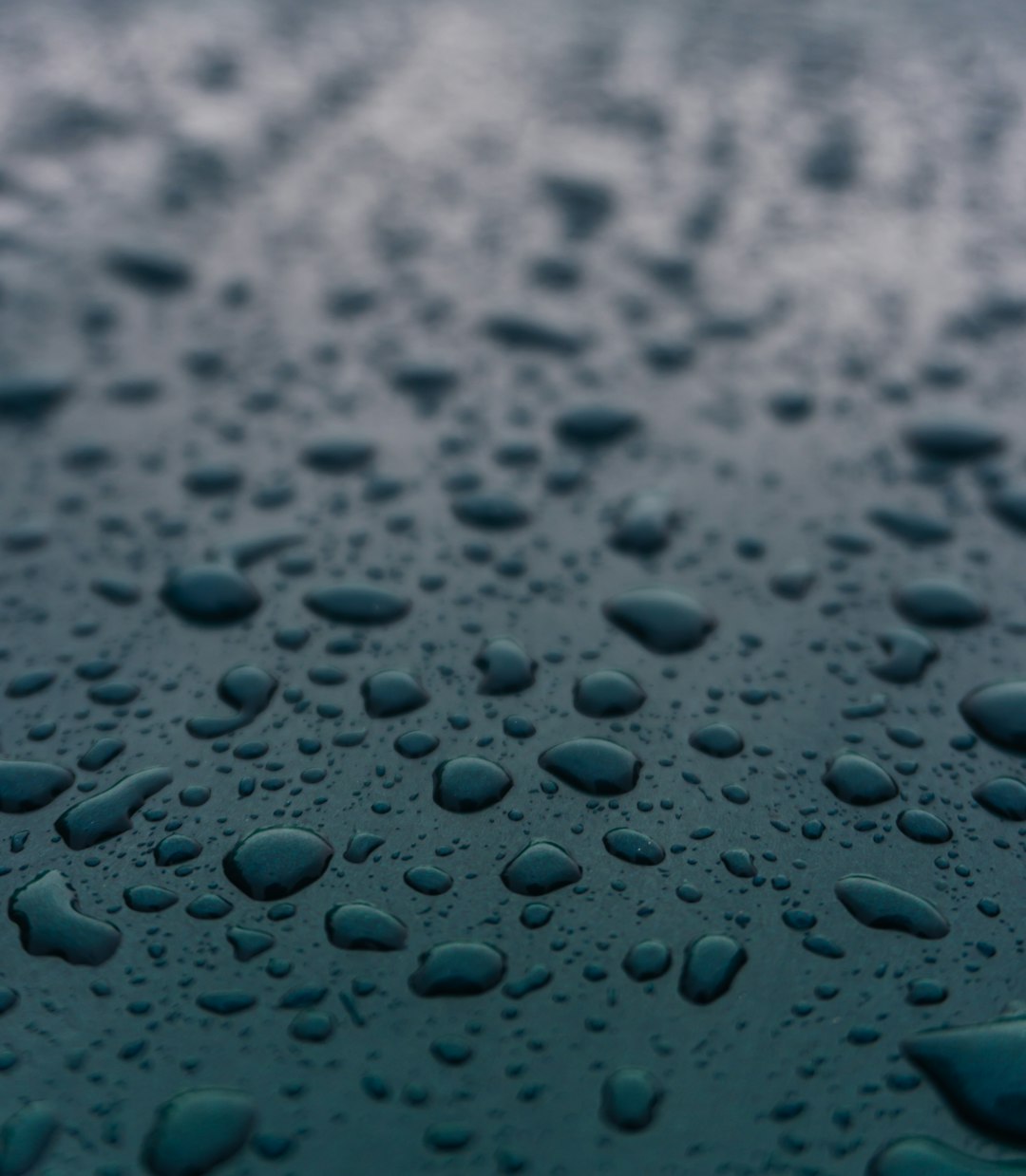 water droplets on blue surface