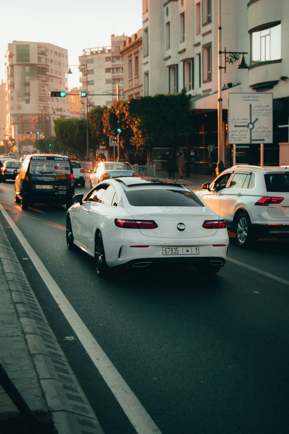 white porsche 911 on road during daytime