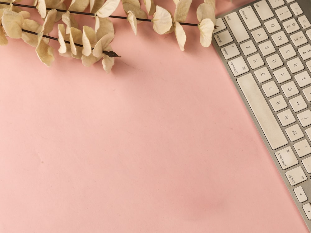 white wooden decor on pink table